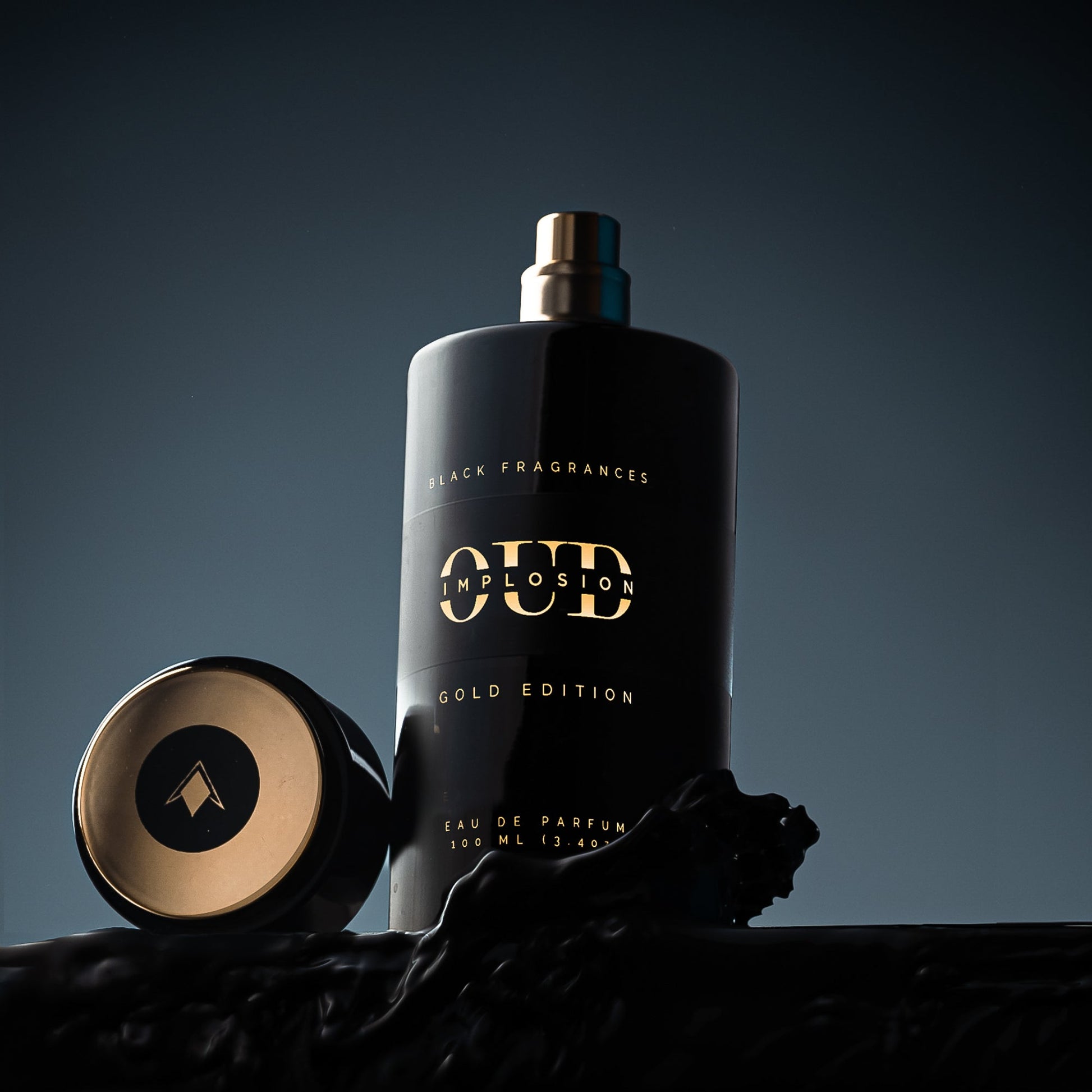 Black bottle with gold accents, Oud Implosion Gold Edition Eau de Parfum 100ml.